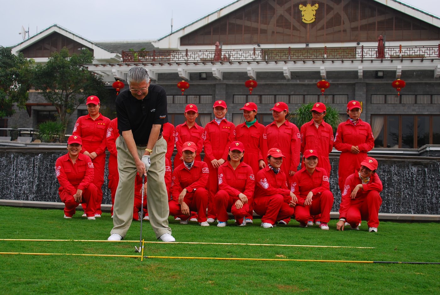 Brett Brasier addressing the ball during a golf clinic in China