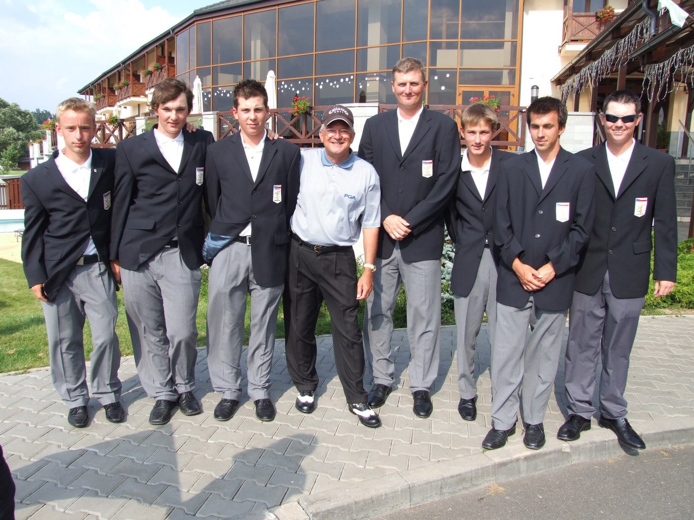 Brett Brasier with a junior national golf team in blazers