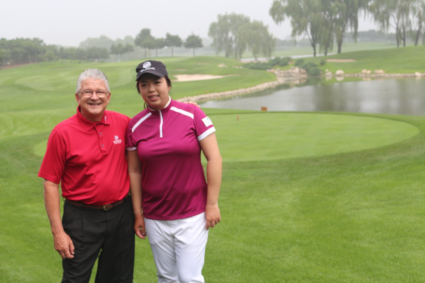 Brett Brasier with Chinese professional golfer Shanshan Feng at Reignwood Pine Valley