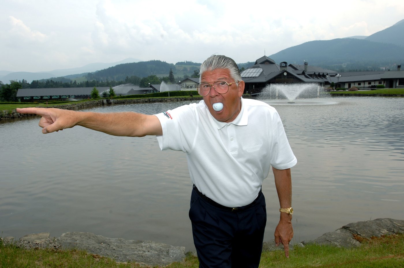 Brett Brasier posing with a golf ball and his tour bag at Prosper Golf Resort Čeladná