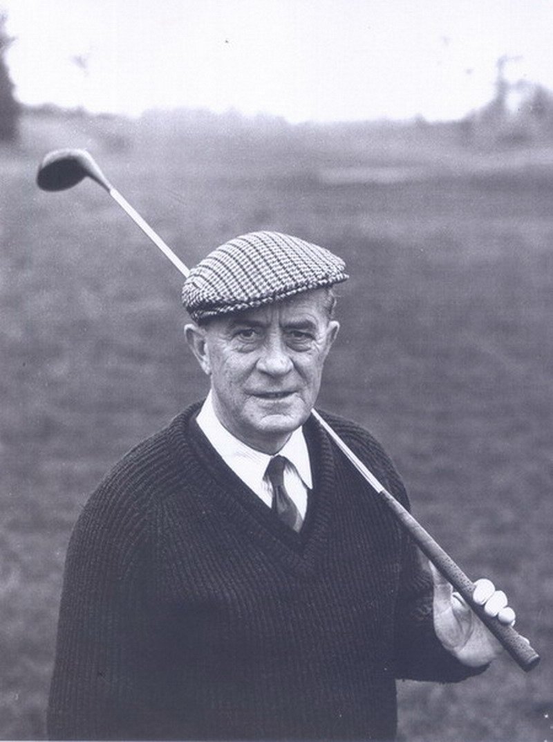 Douglas Brasier portrait, holding a golf club over his shoulder