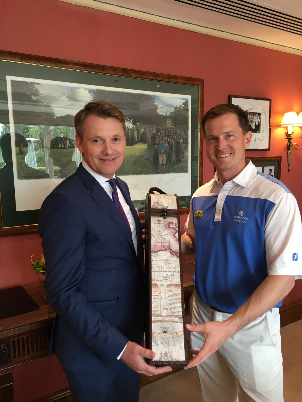 Michael Brasier, as Reignwood Pine Valley GM, accepting a gift from former Wentworth CEO Stephen Gibson